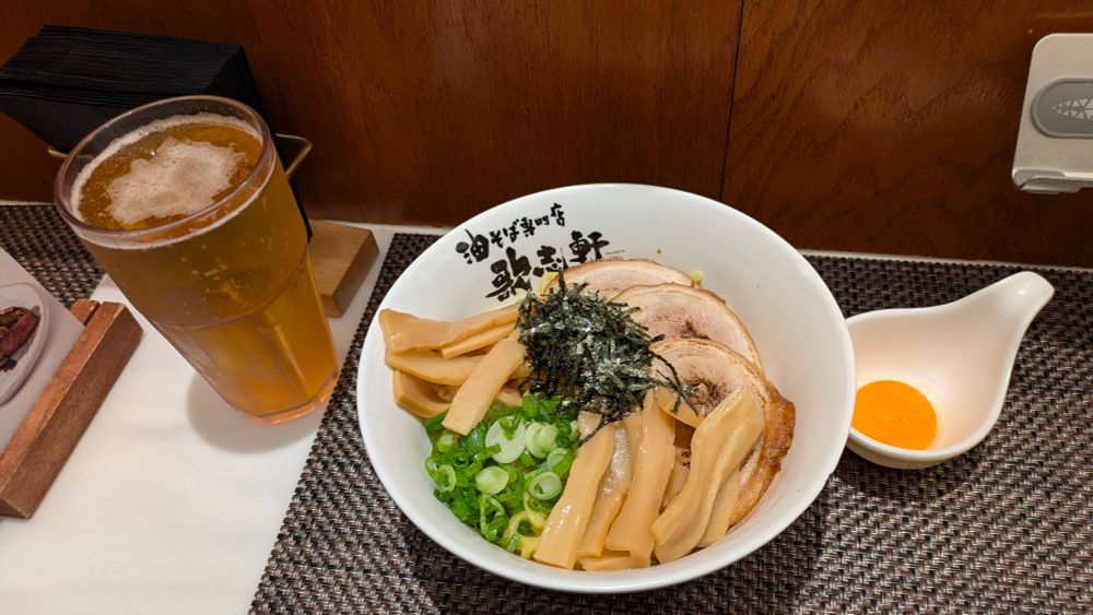 With cold draft Orion beer and raw egg!!!! it was AMAZING 