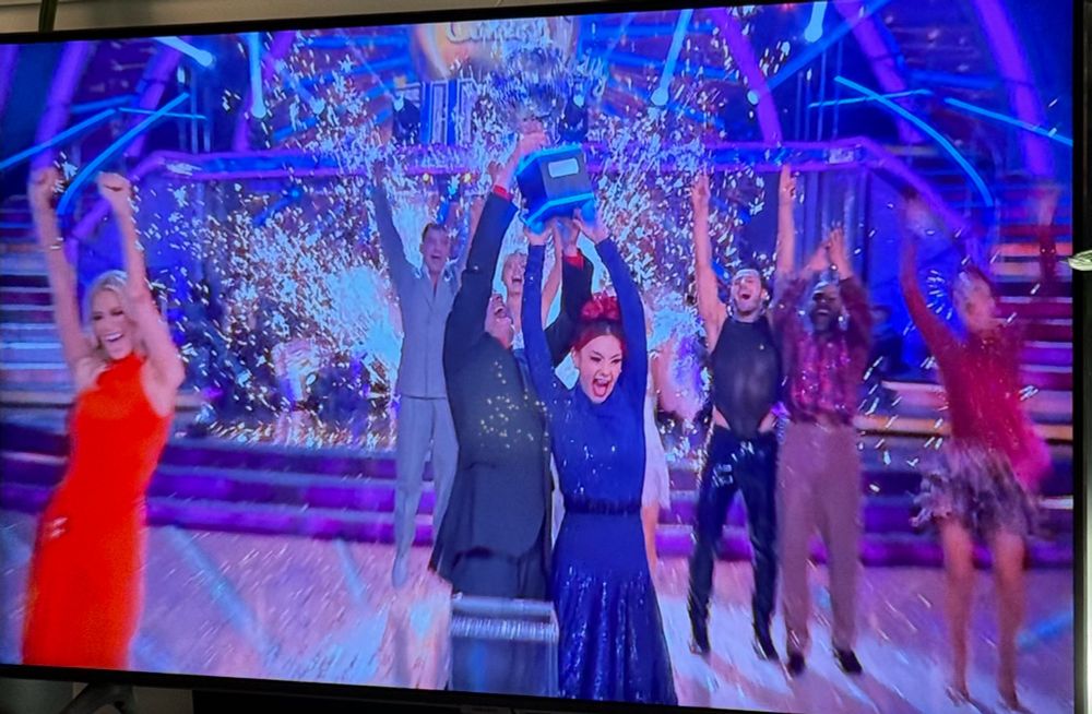 Chris McCausland and Diane Buswell celebrating with the strictly come dancing trophy