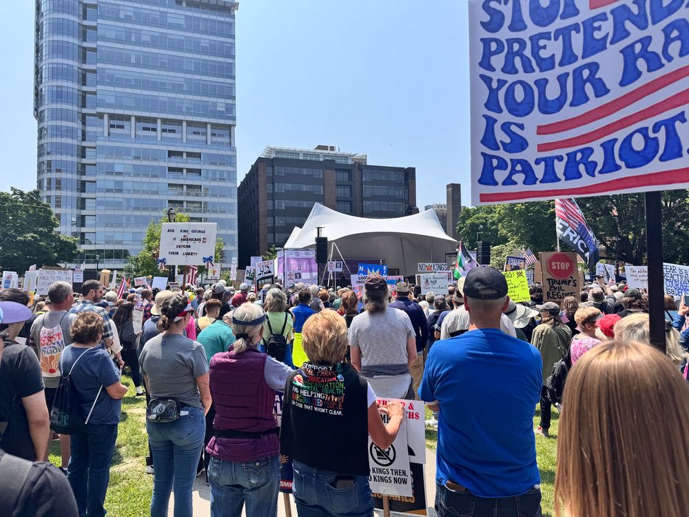 A group of protesters gather in Cathedral Square Park in Milwaukee, WI to listen to activists speak.