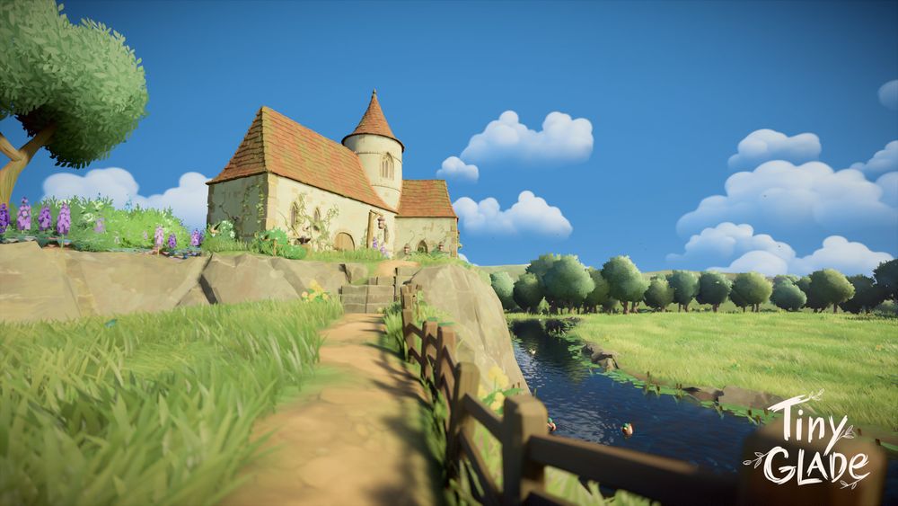 Screenshot in Tiny Glade of tiny cottage style castle looking over a pond.