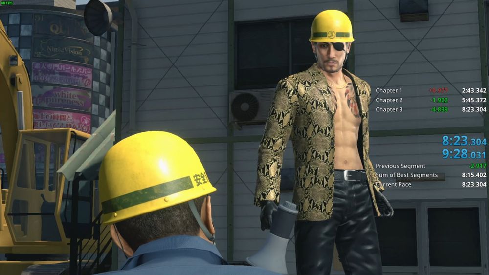 A screenshot from Yakuza Kiwami 2 primarily showing Majima holding a megaphone and looking at Nishida; a timer on the right hand side also shows a completed run time of 8:23.304 (loadless)/9:28.031 (real time)