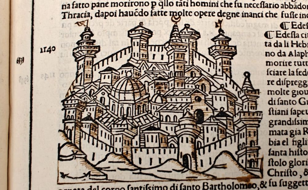 City of Edesta woodcut, with added shading and flags on top.