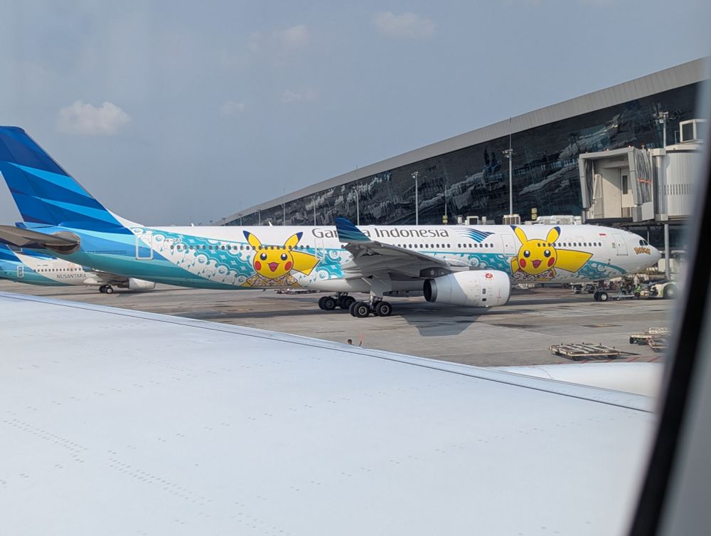 Garuda Indonesia airplane with Pikachus on it wearing batik