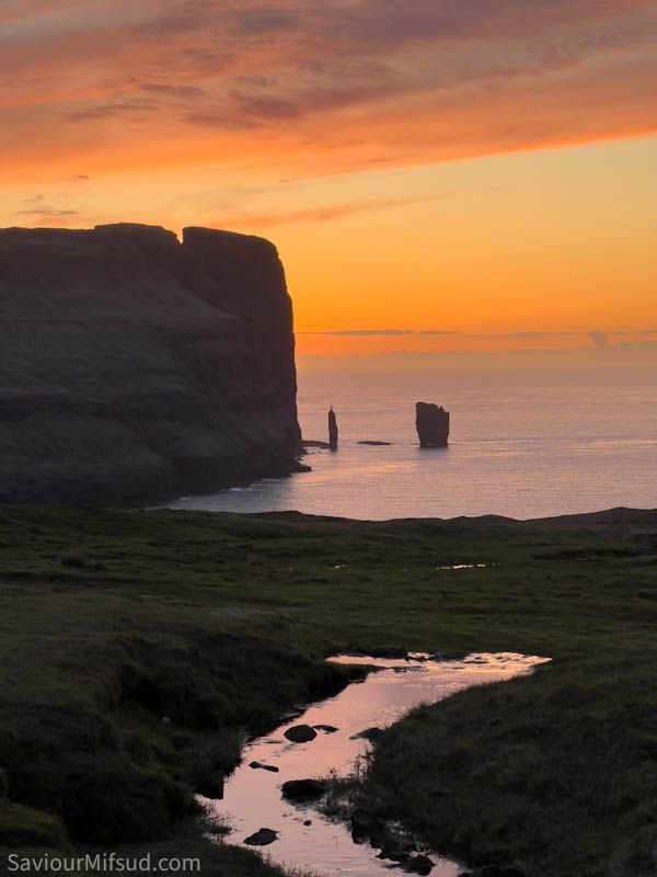 The sea stacks Risin and Kellingin with an amazing sunset light. Faroe islands