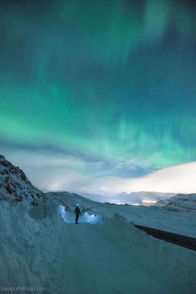 Watching the northern lights from mount Sornfelli Faroe Islands