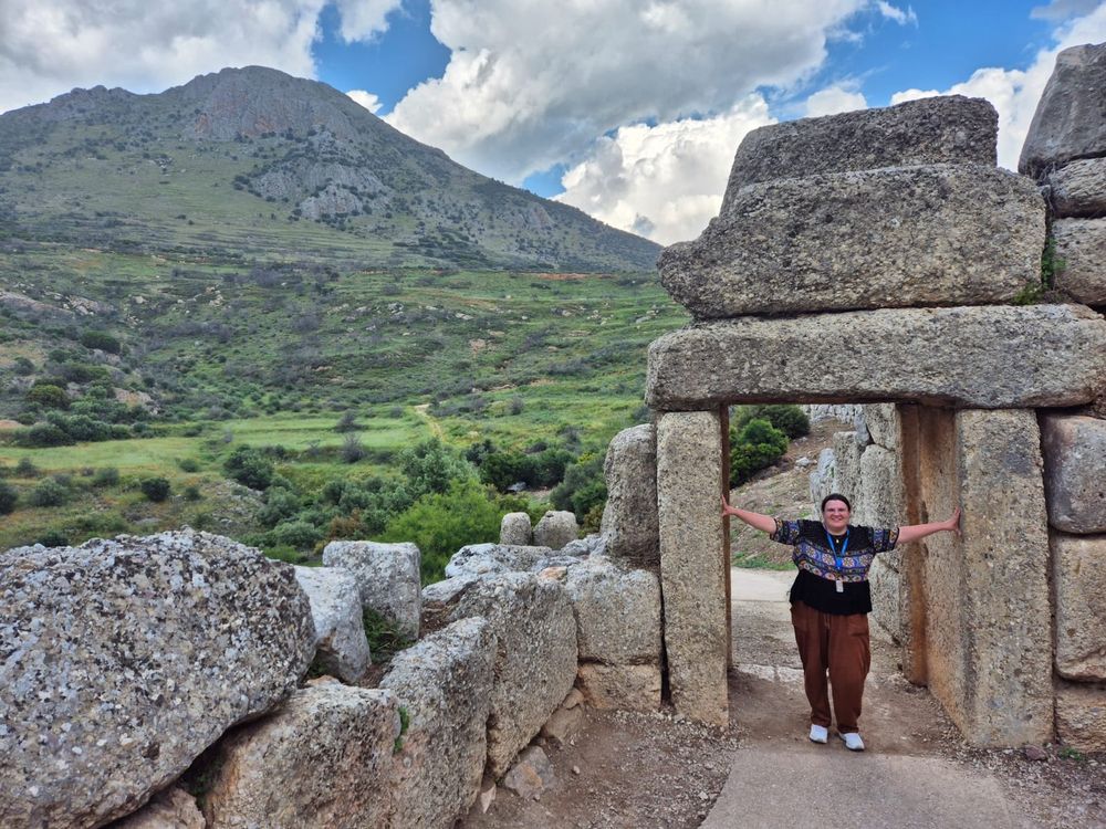 Me at the northern/postern gate of Mycenae, with an impressive hilly landscape behind