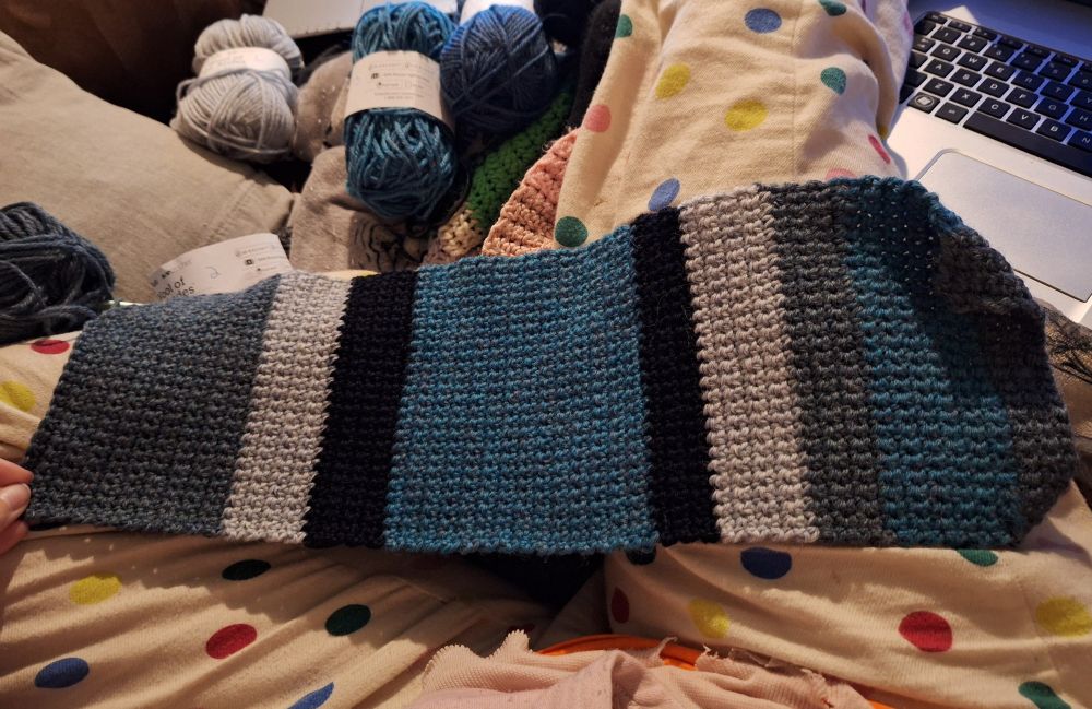 the same scarf but now it's about 100 rows of single crochet and approximately the length of my forearm.