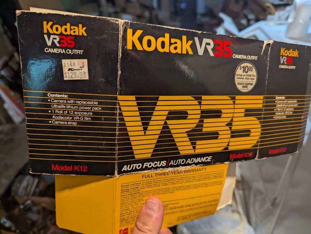 Flattened box from an extremely 1980s point and shoot camera, still has the Kmart price tag: $129.99