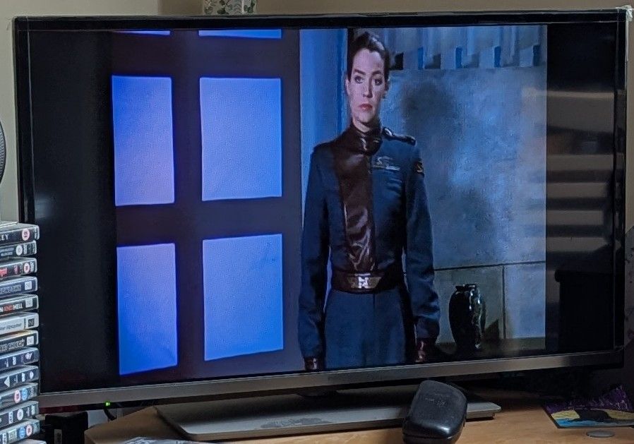 Picture of a TV showing an episode of the 90s TV show Babylon 5.