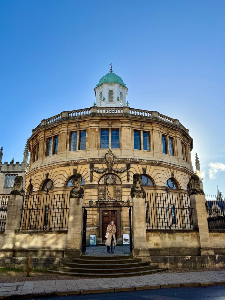 The Sheldonian Theatre with a bright blue sky behind 