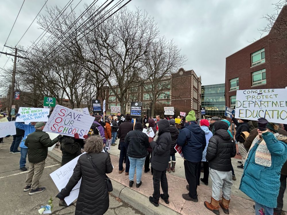 A rally outside Binghamton high school with people holding signs saying Save Our Schools and Congress: Protect the Department of Education.