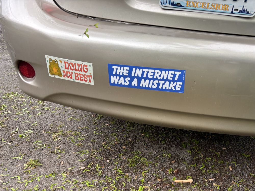 Car bumper sticker "The Internet Was A Mistake" and a second sticker "Doing My Best." 