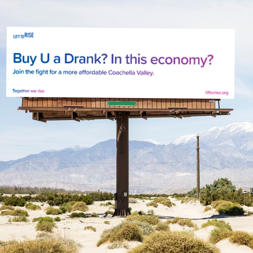 Billboard that reads “Buy U a Drank? In this Economy?” Join the fight for a more affordable Coachella Valley.” Together we rise. Visit lifttorise.org