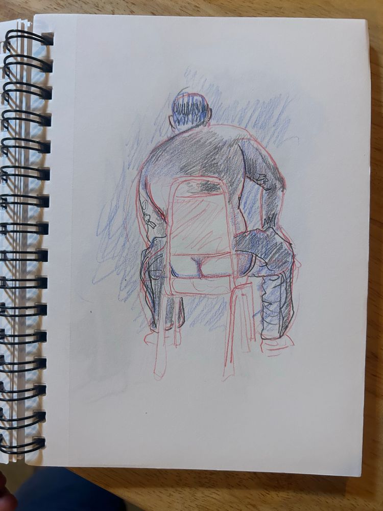Colored pencil sketch of a man in leather chaps, rear view, seated in a chair