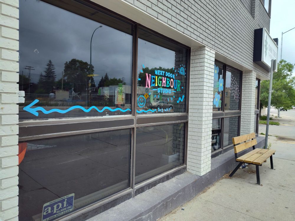 Fun window art at Next Door Neighbour Studio! This bus stop has gotten much busier with the new transit system - it's actually rare to not see someone at it. 