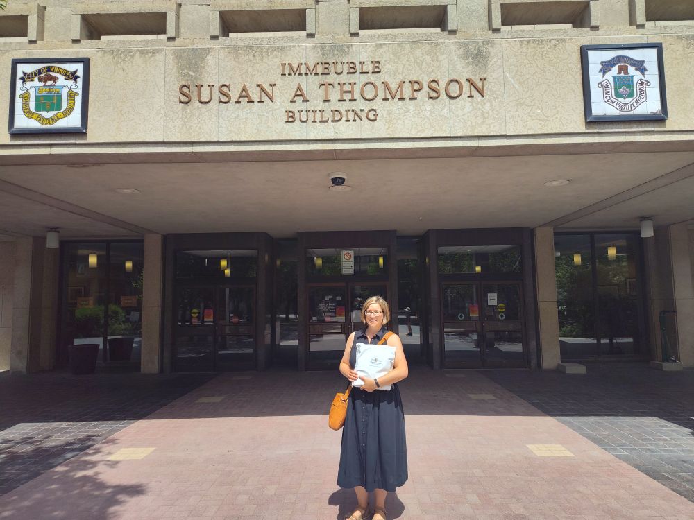 Standing with my candidate registration package in front of the Susan A Thompson Building at Winnipeg City Hall. 