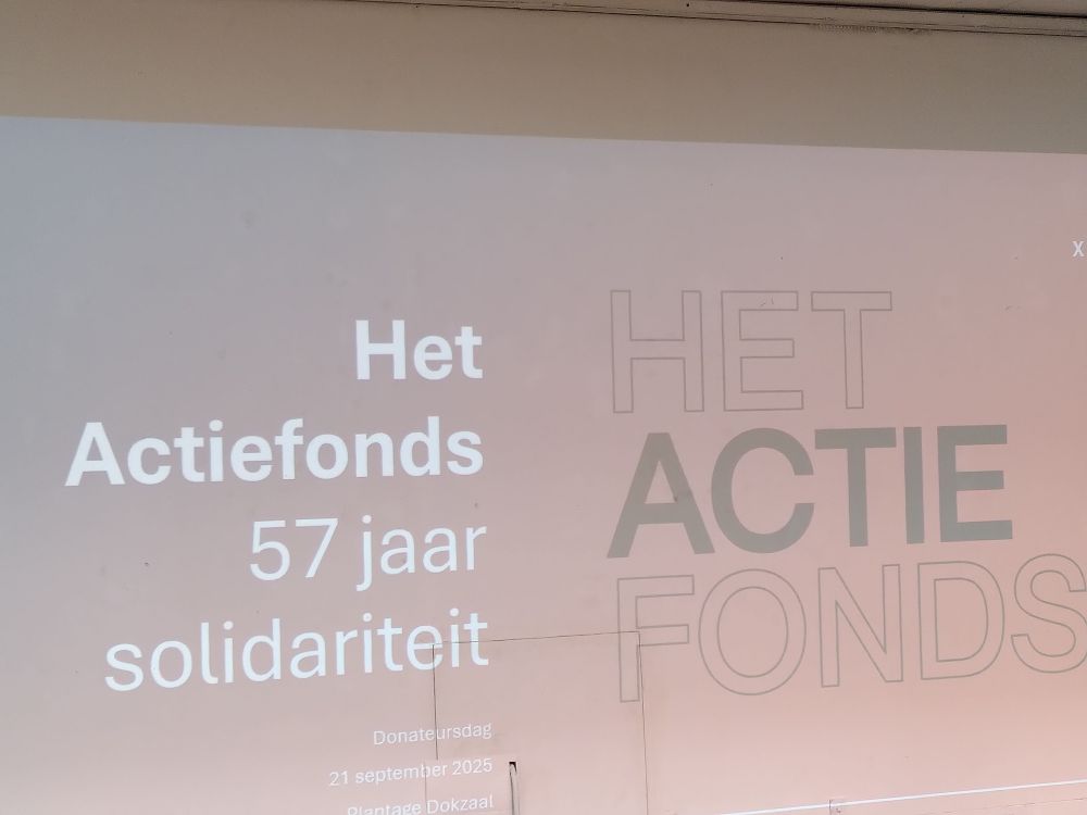 Slide stating 'Het Actiefonds, 57 jaar solidariteit'