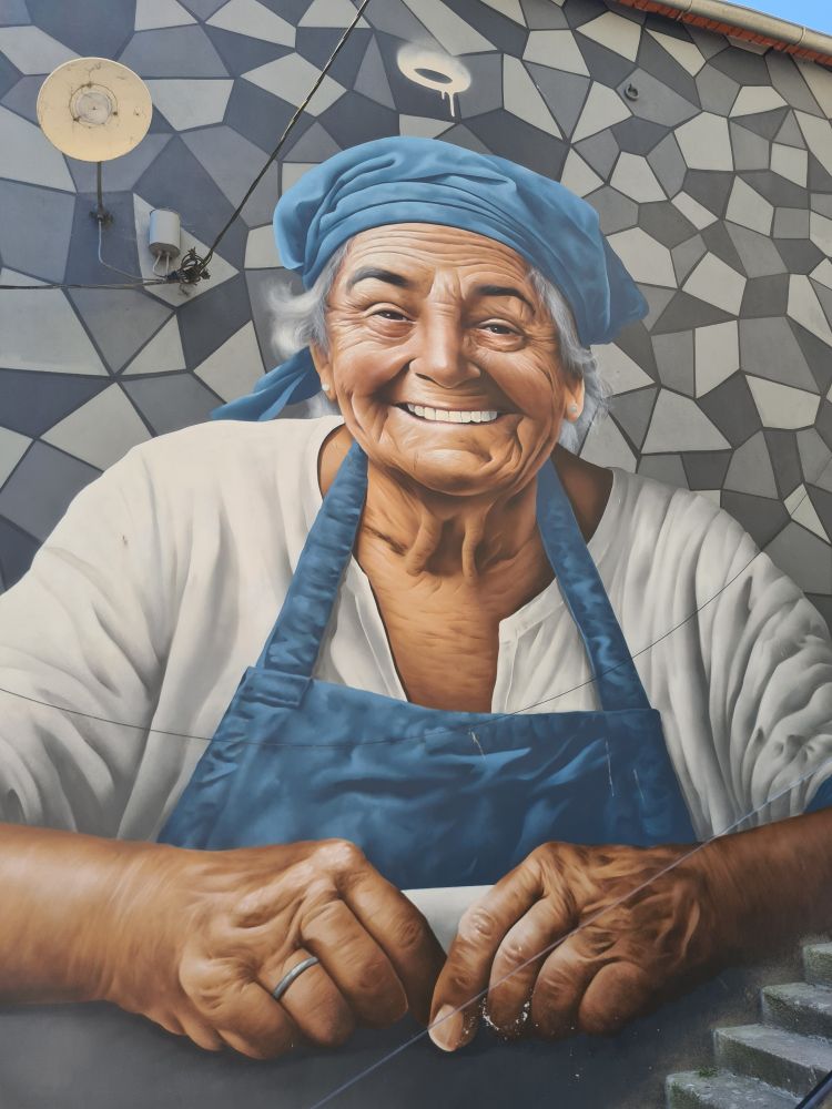 Wall mural of a lady in a blue hat and blue apron.