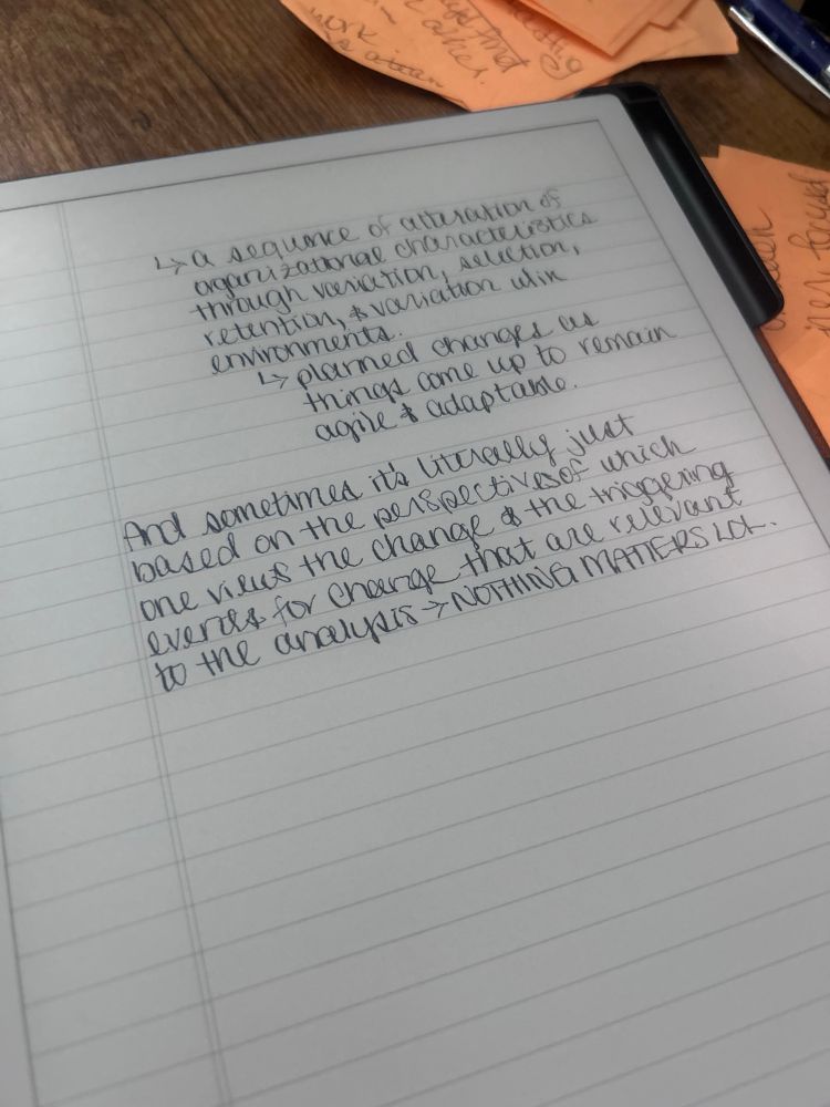 The grad school notes of a burnt out millennial who is learning about organizational change while also living in the year of our lordt 2025. Photo includes a paper tablet with part of a break down of how some life cycle analysts view what I’d call organic organizational change but for some reason they have to make it sound more complicated than it is lol - so anyway the notes spiral from that topic to “NOTHING MATTERS LOL.” and that’s where we’re at folks. 