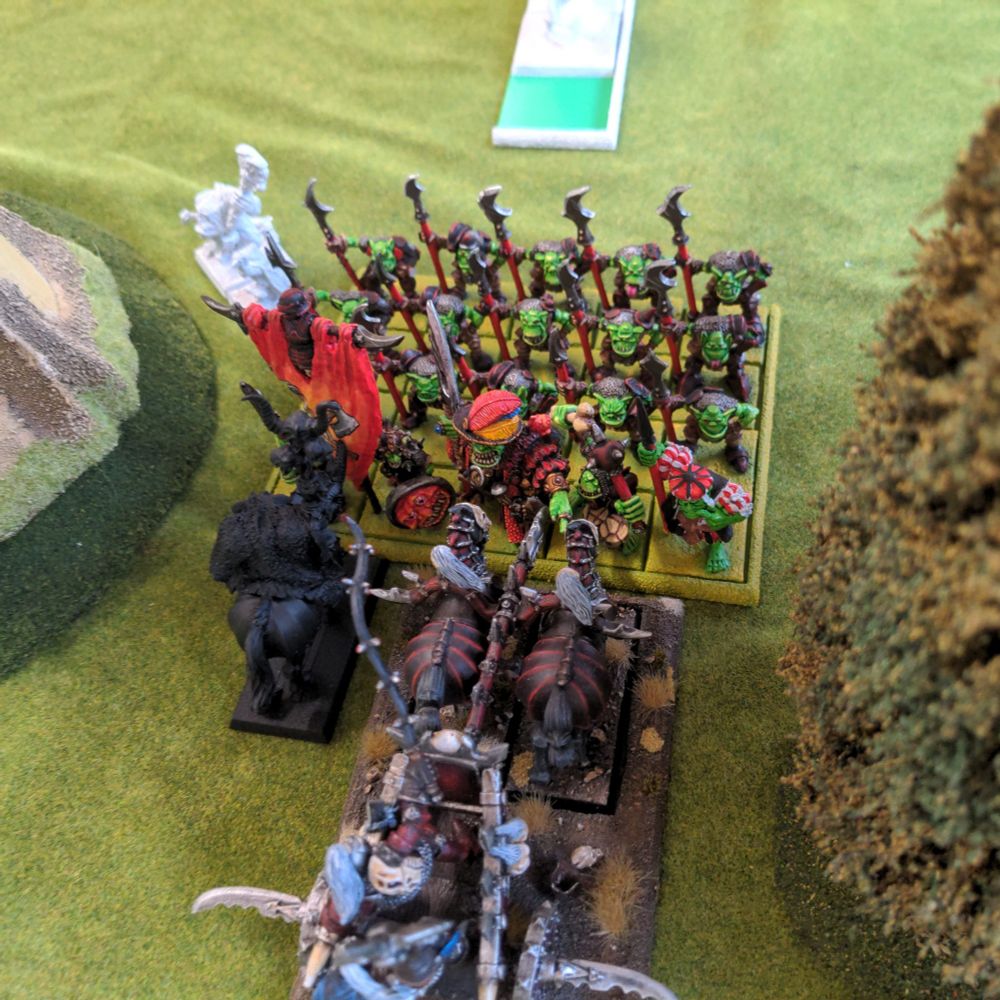 A unit of orcs face off against a chaos chariot and mounted sorcerer. I was a bit worried that this might be a quick end to my hopes in this game, but luckily my decision to tool these gits up to the gills with everything I could slap on them paid off and they managed to see off these formidable foes admirably dispatching them in two rounds of combat without too many casualties.