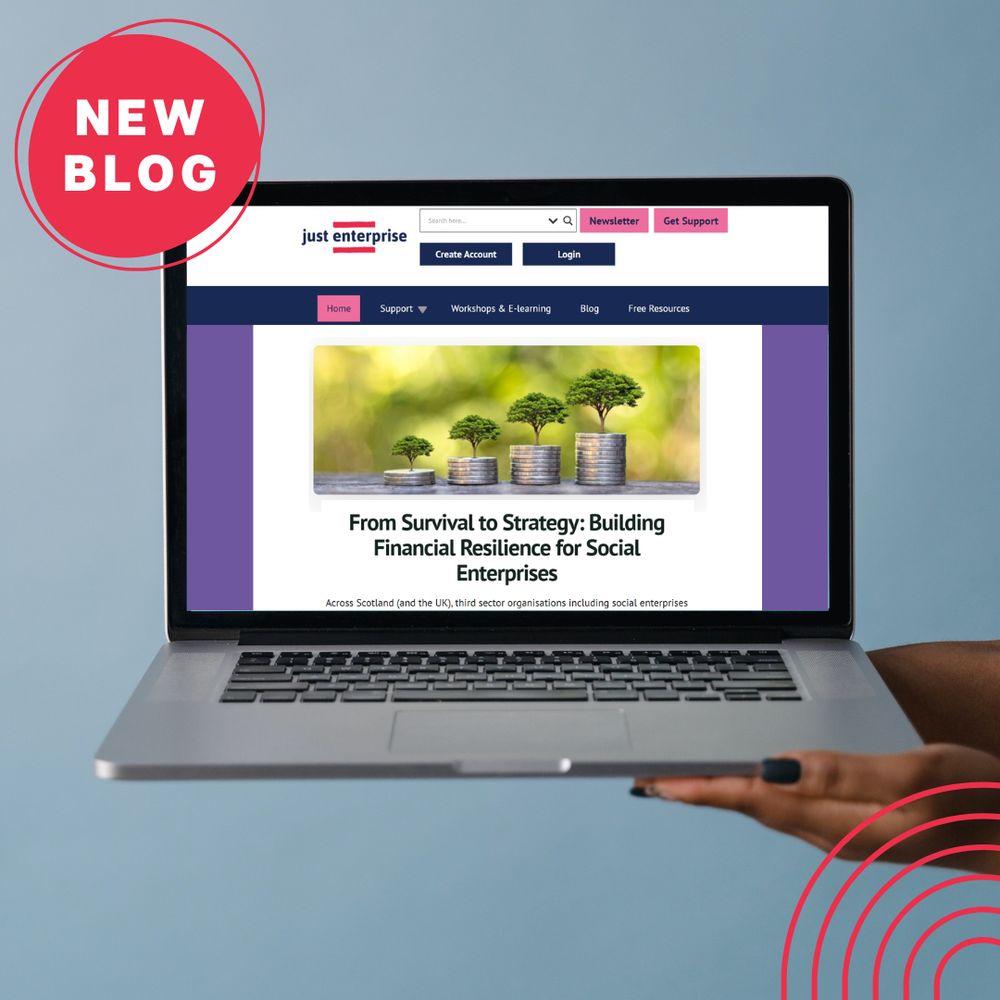 A person holds a laptop displaying the Just Enterprise website. On screen is a blog titled “From Survival to Strategy: Building Financial Resilience for Social Enterprises”, with a header image of trees growing from stacks of coins. A red circular label in the top-left corner reads “NEW BLOG”, and red ripple graphics appear in the bottom-right corner. The background is a plain light blue.