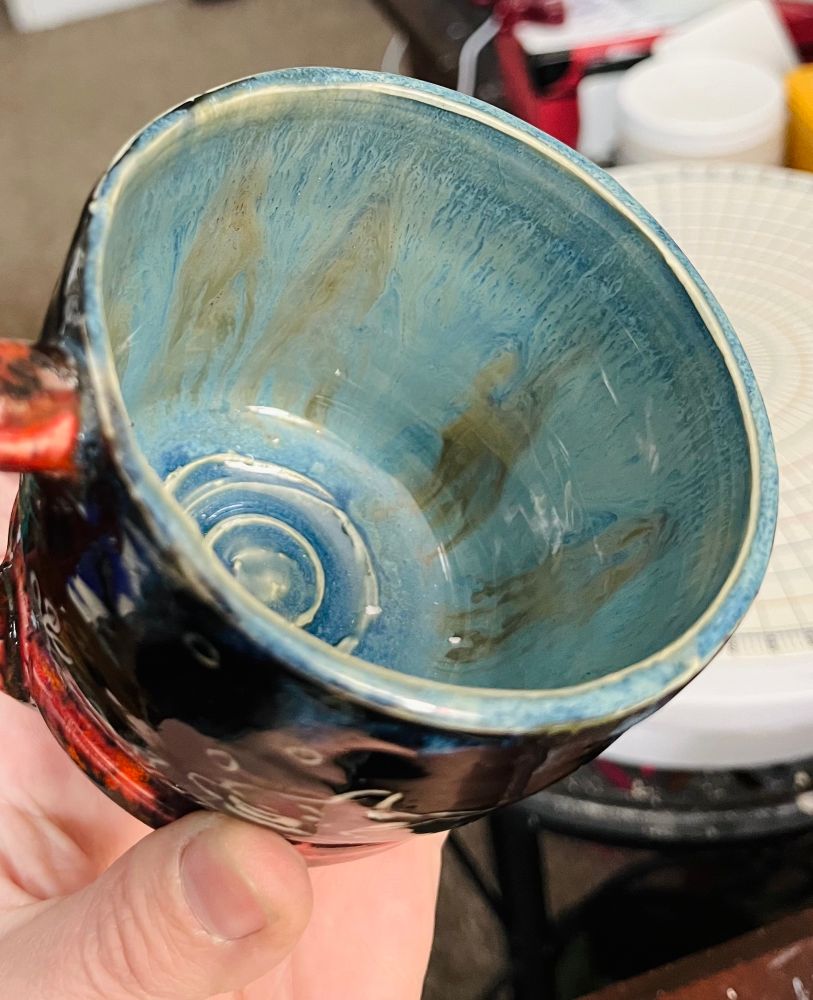 A mug with blue gray glaze inside 
