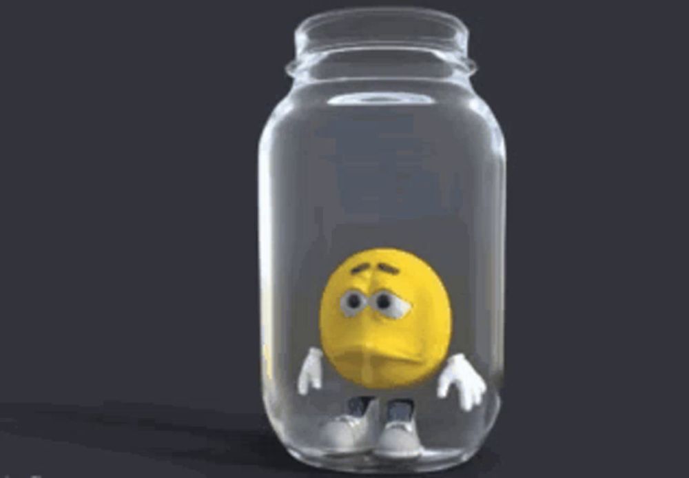 a yellow smiley face in a glass jar