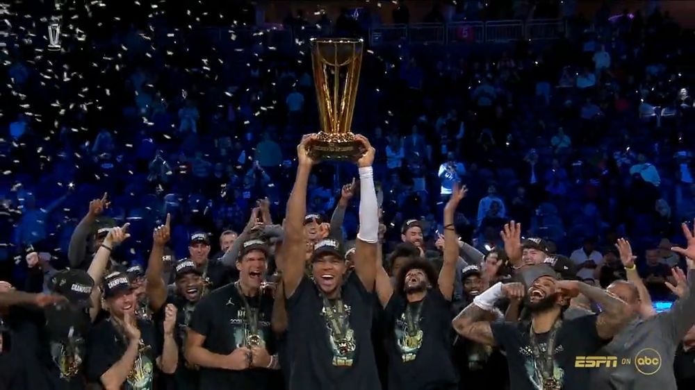 Giannis, raising the NBA Cup trophy.