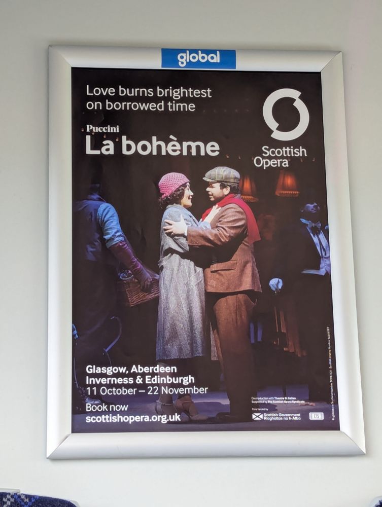 Poster for Scottish Opera's La Boheme, showing Rodolfo and Mimi embracing with a tag line reading "live burns brightest on borrowed time". 