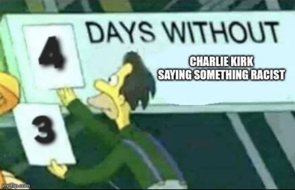 Character is changing number on a sign from 3 to 4

Sign reads “days without Charlie Kirk saying something racist”