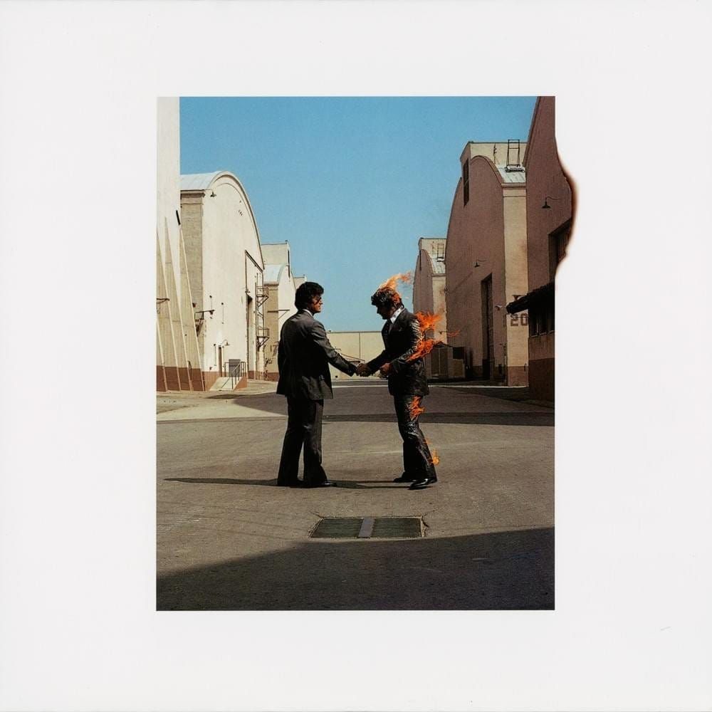The album cover for Pink Floyd's "Wish You Were Here"