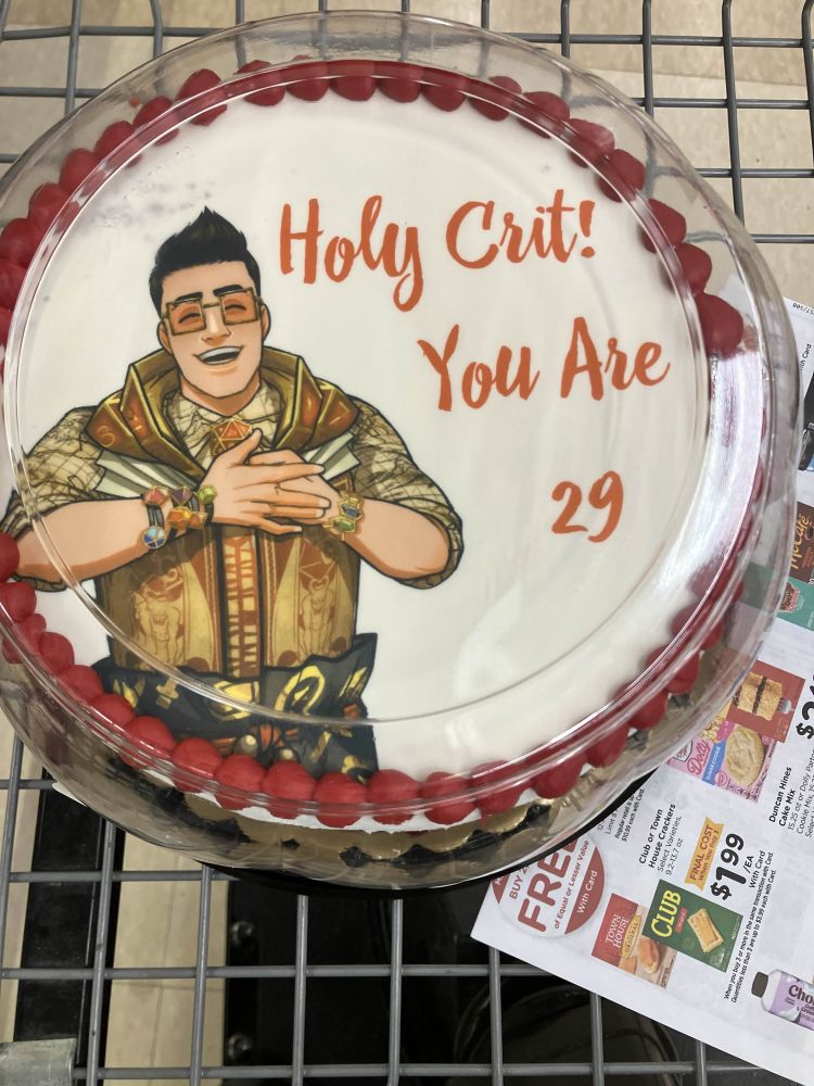 White cake with red border. It has Chance from Date Everything on it and says “Holy Crit! You are 29”.