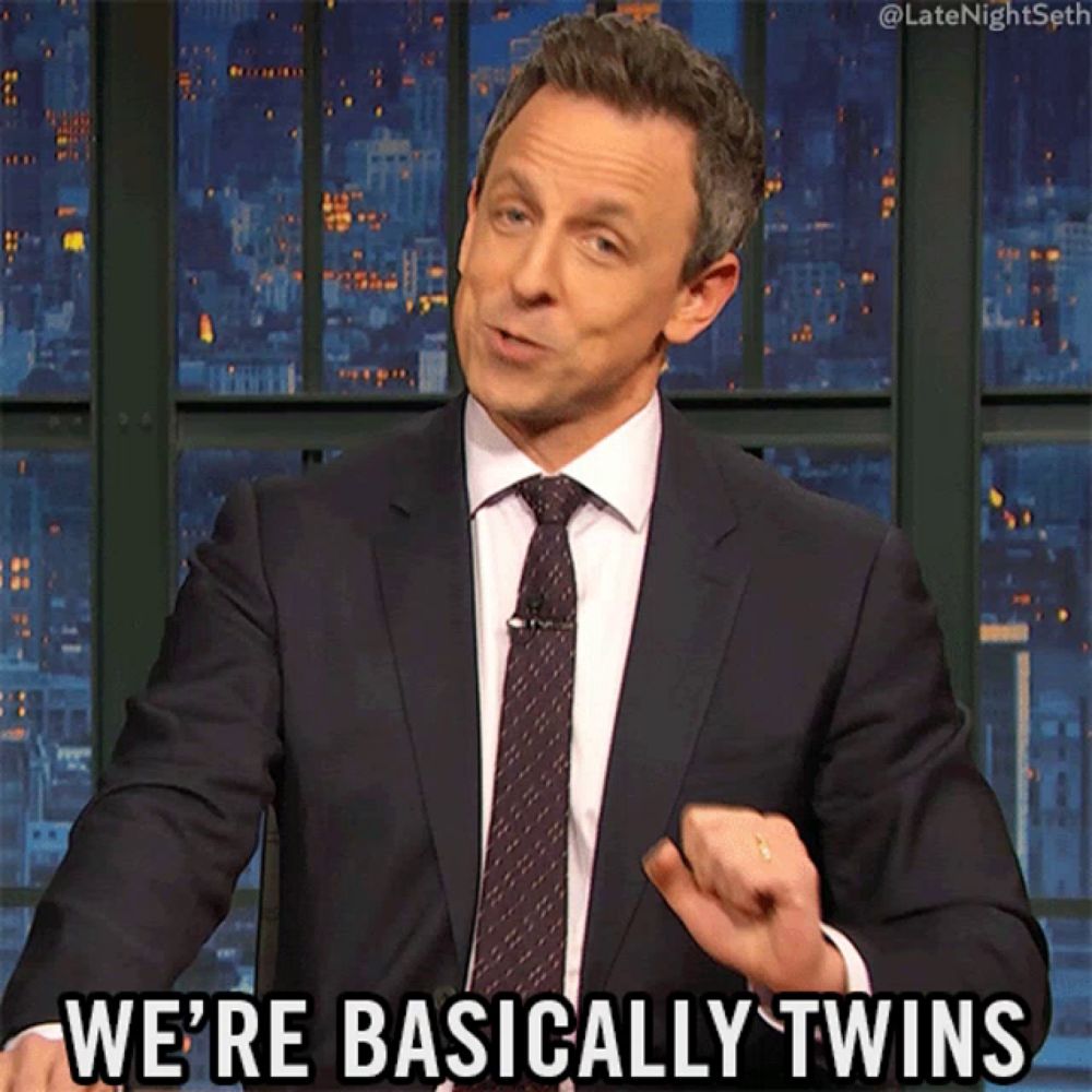 a man in a suit and tie says we are basically twins