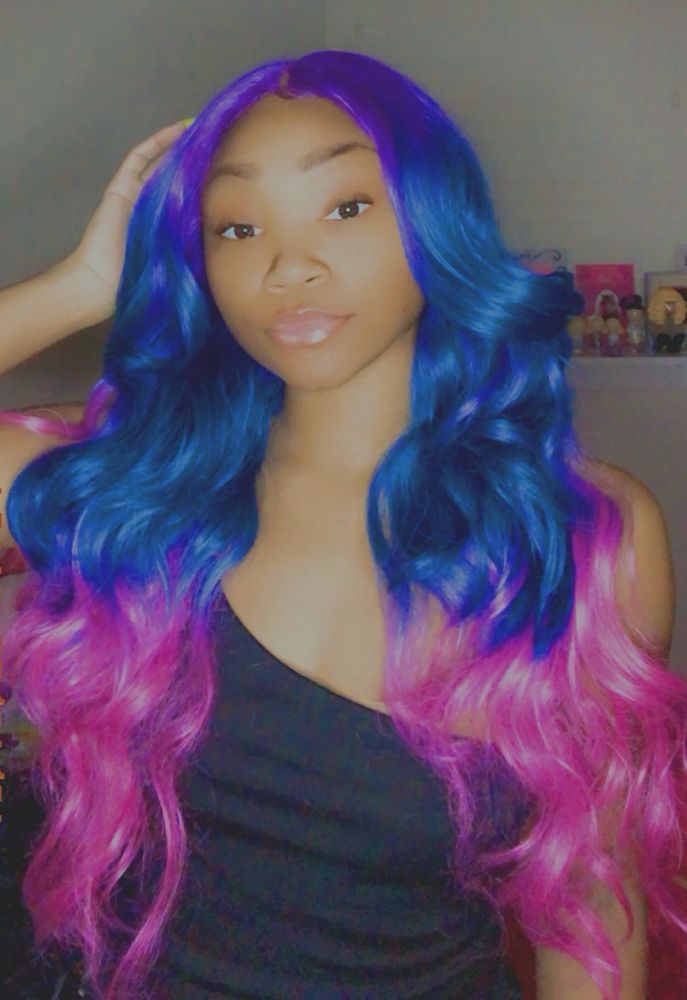 A woman with purple blue and pink hair 