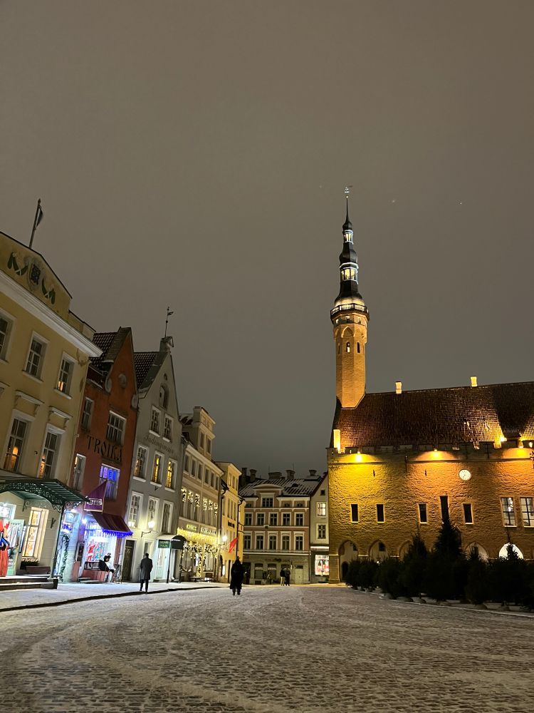 Tallinn old town square at night after a light snow fall