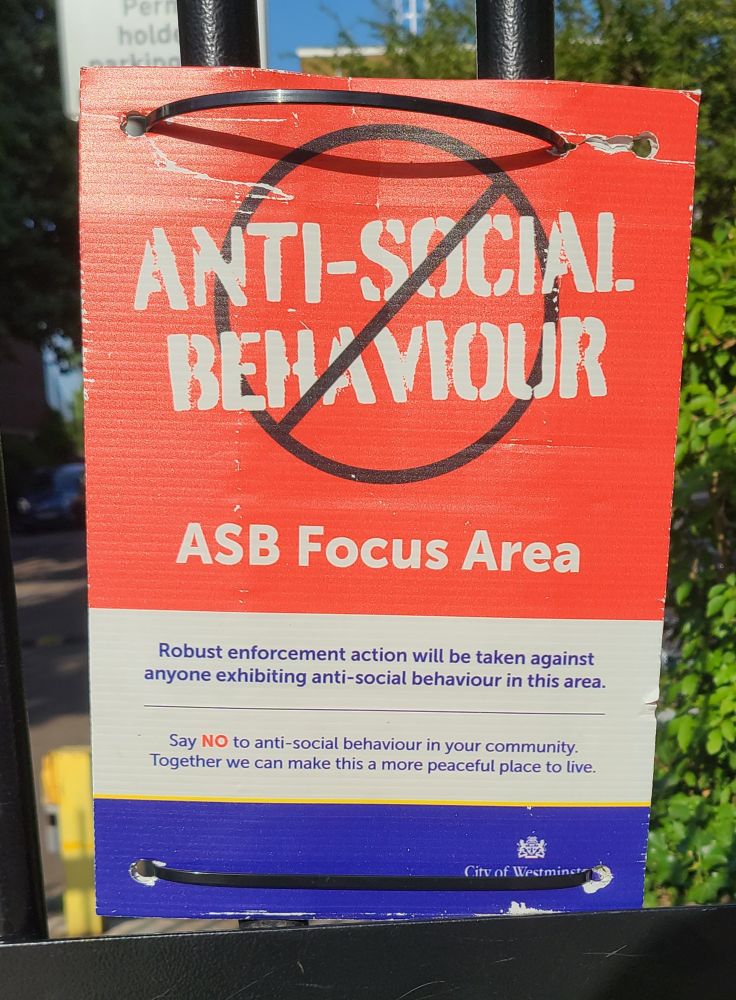 Metropolitan Police anti-social behavior special enforcement zone placard on a council housing estate back of Marylebone Station.