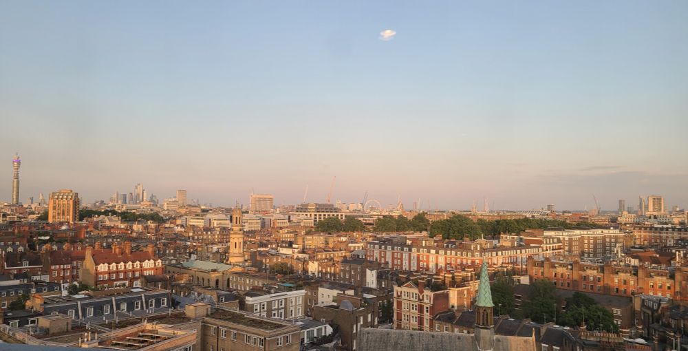 London rooftops, looking from Edgeware Road toward Canary Wharf in the far distance.