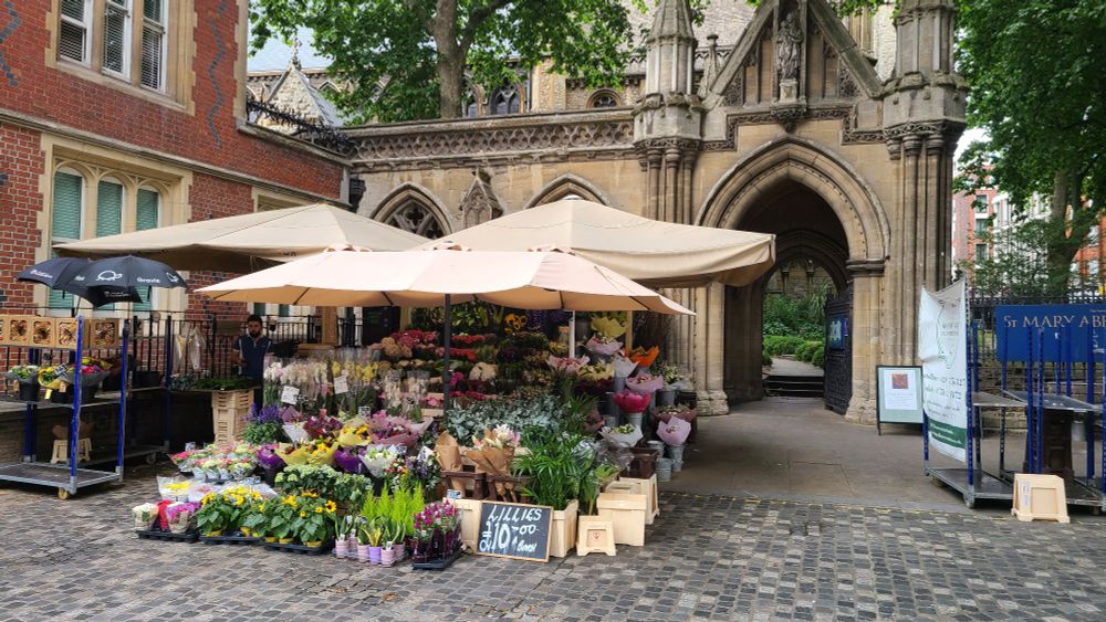 Flower market in front of Gothic arch, Kensington High Street.