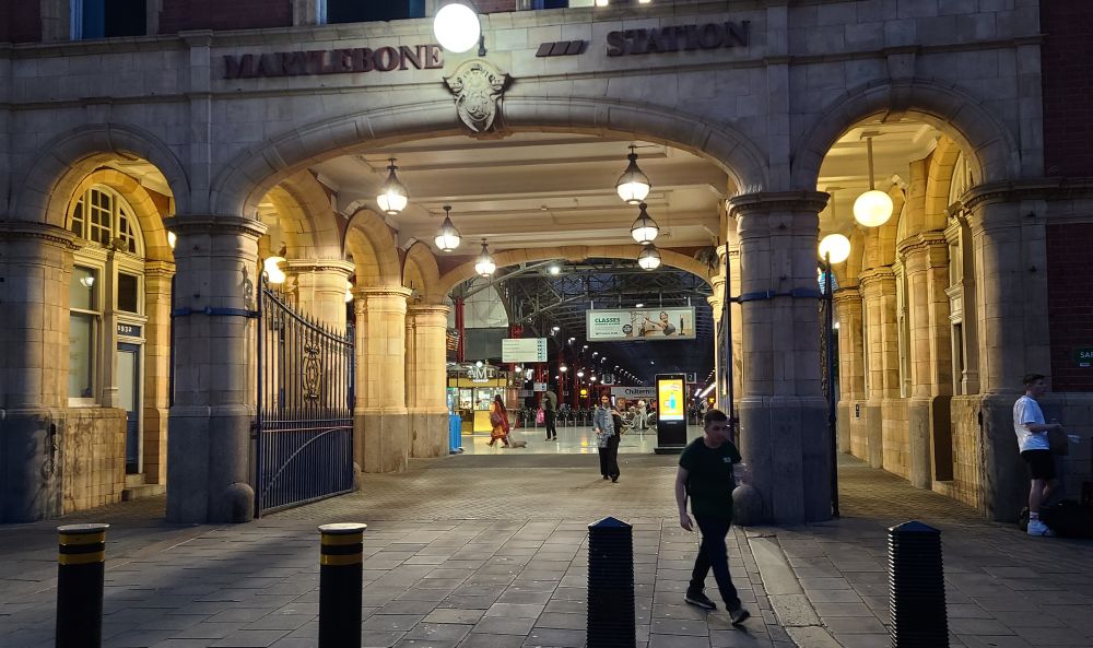 Night travellers at Marylebone Station archway.