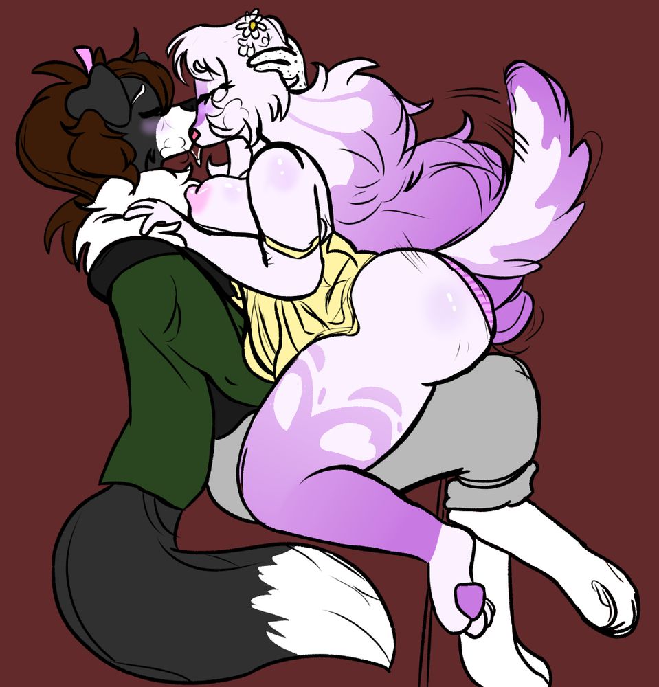 Two dog girls fuckign kissign,.,.,. pink one sitting in the black and white one's lap as they smooch and her boobers are out waow,.,.,..,