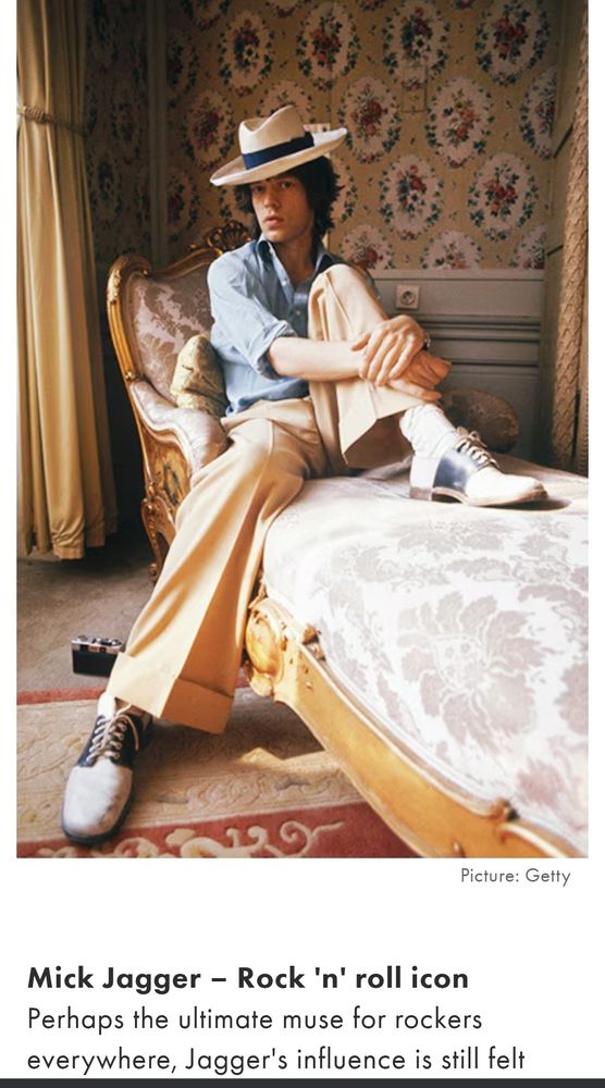 A screenshot from an online article showing a photo of Mick Jagger, dressed very stylishly in a panama hat, open collared shirt, cuffed slacks, and two tone brogues.
