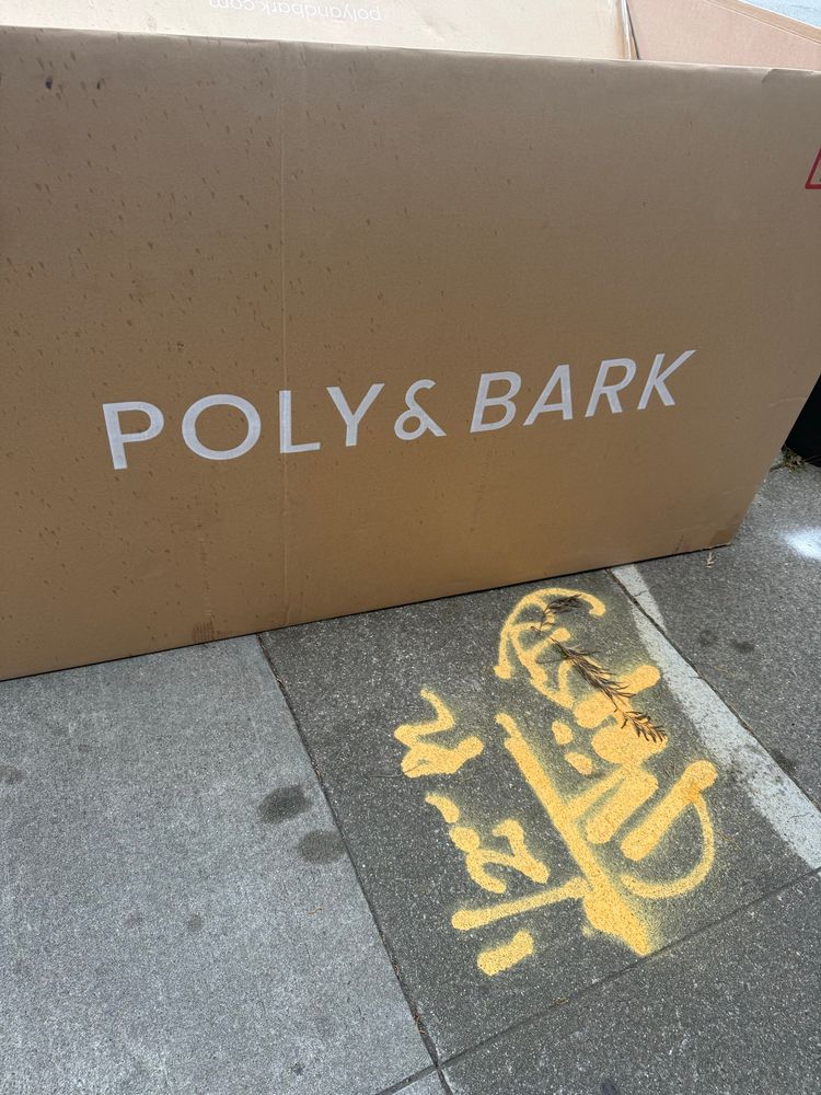 A box on the sidewalk labeled “poly &
bark”, i have no idea what was actually inside it 