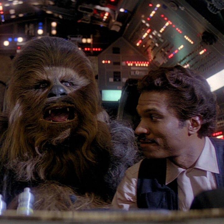 Chewbacca and Lando Calrissian in the cockpit of the Millennium Falcon