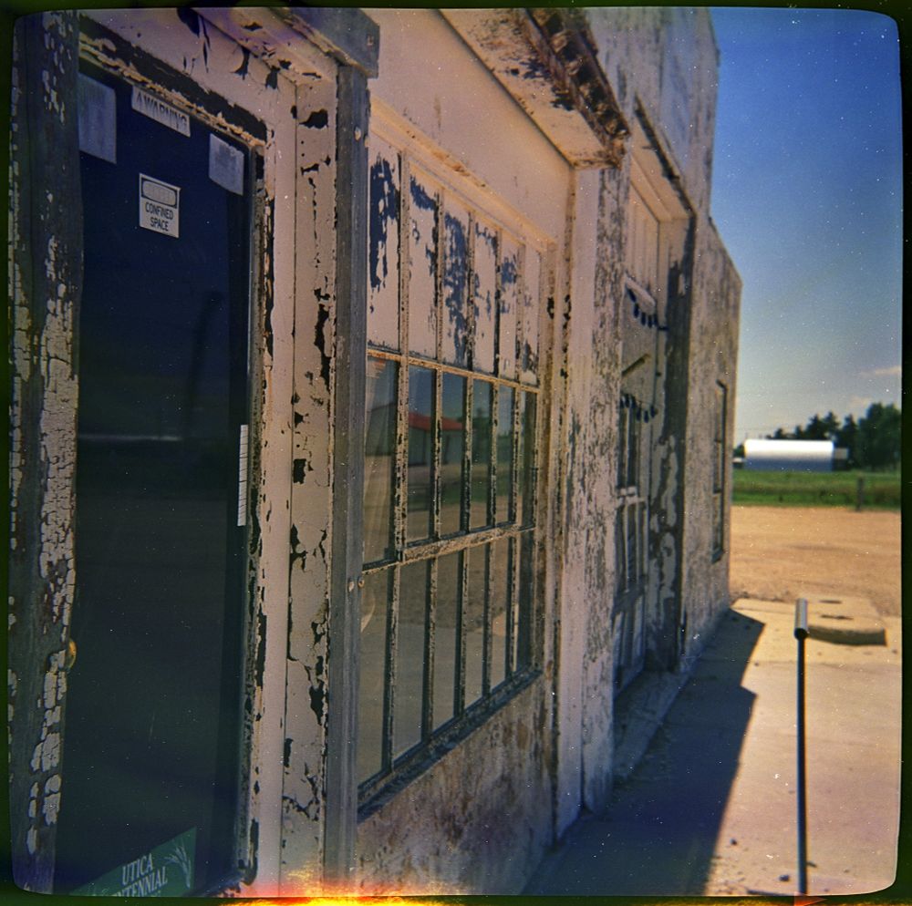 A close up of the side of an old service station. 