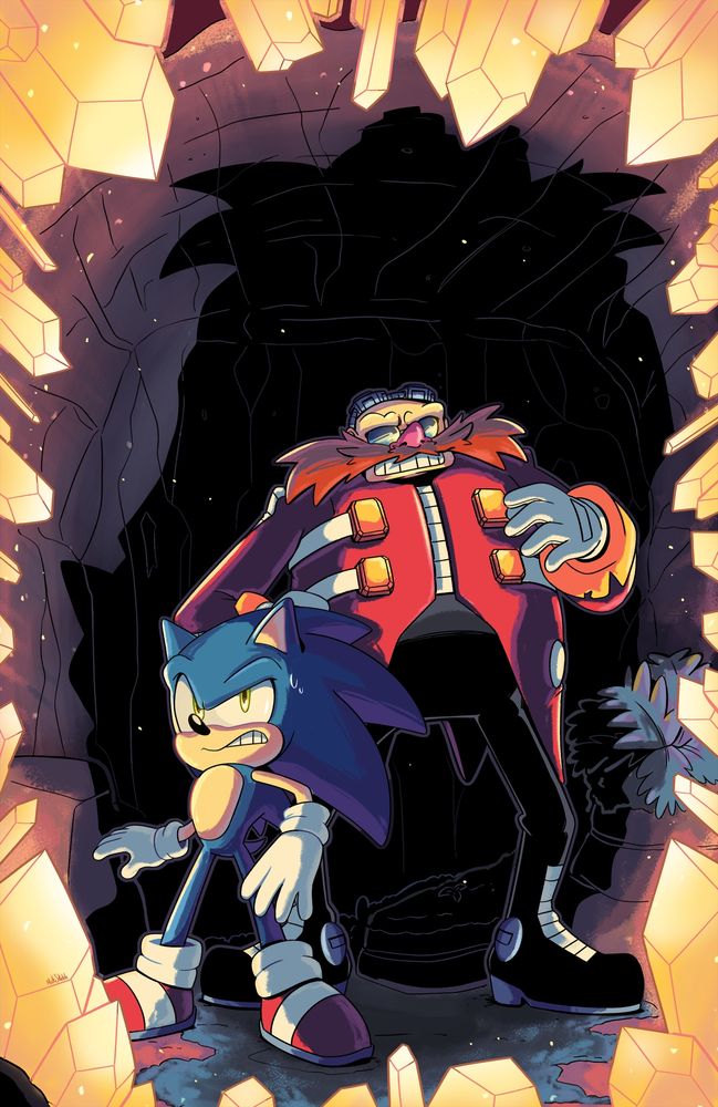 Sonic and Eggman look on, nervously, as they are backed into a cave wall by the encroaching golden crystals, their own shadows looming above them.