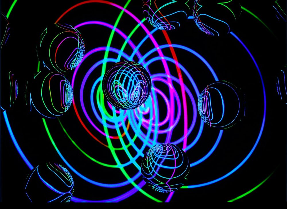 Image of quantum physics waves and electrons in bright colours. 