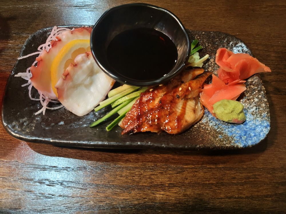 Octopus and eel sashimi served with soy sauce