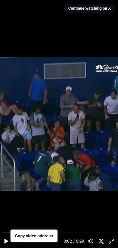 Video still showing both people reaching for the ball and not showing that either of them in fact had it first.