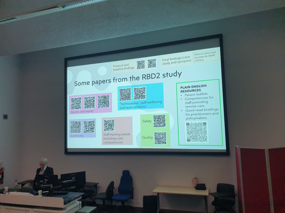 Trish Greenhalgh stood in front of a slide from her lecture with QR codes to key papers from the RBD2 study