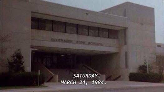 Opening scene of the movie The Breakfast Club, a drab school building with the date written over it “Saturday, March 24, 1984.”